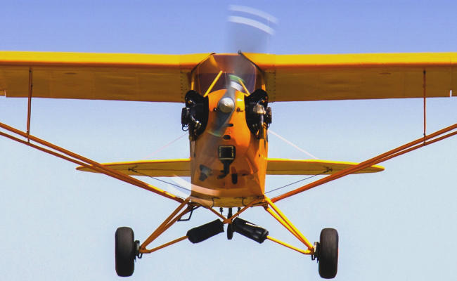 piper cub landing ready for an aircraft appraiser